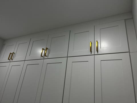 Finished shaker cabinetry with brass pulls